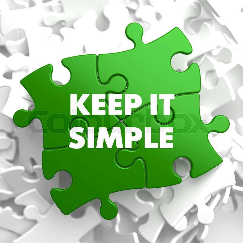 Keep it Simple on Green Puzzle on White Background, stock photo