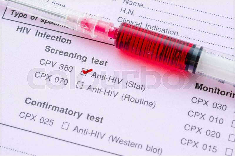 Sample blood in syringe on HIV infection screening test form, stock photo