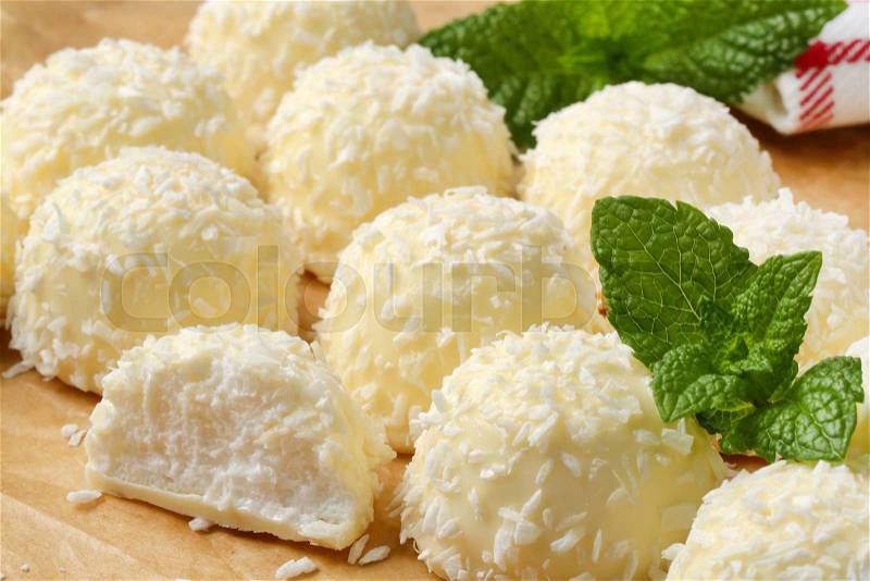 White chocolate snowball truffles rolled in coconut, stock photo