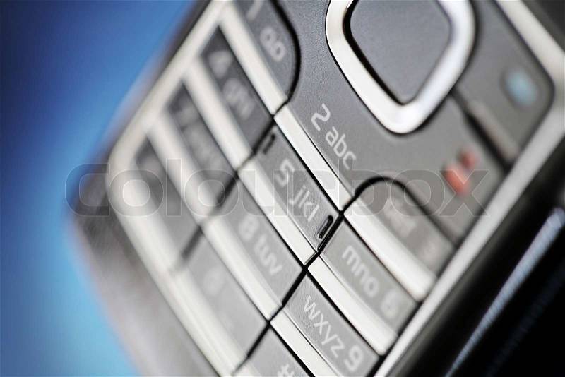 Mobile phone keypad in closeup. Very short depth of field, stock photo