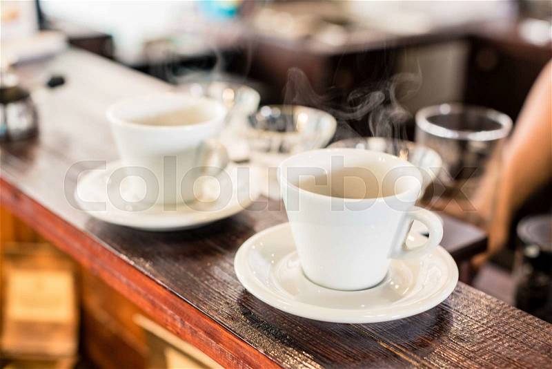 Cups of drip coffee on bar of coffee shop, stock photo