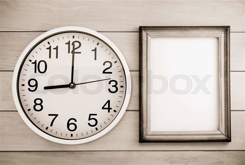 Wall clock on wooden background, stock photo