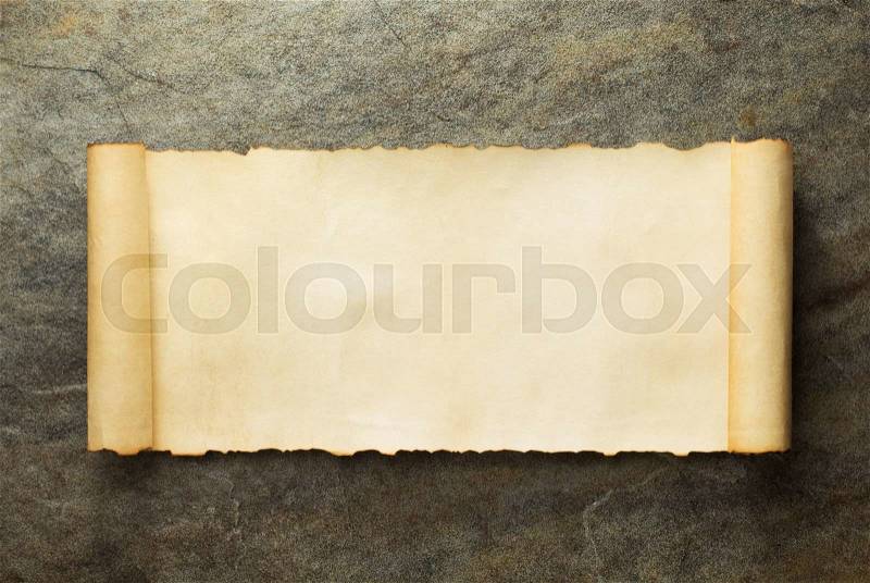 Parchment scroll at old background, stock photo