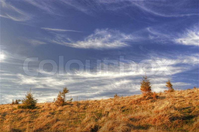 Clouds are drawn in sky of Carpathians (spring, Ukraine), stock photo