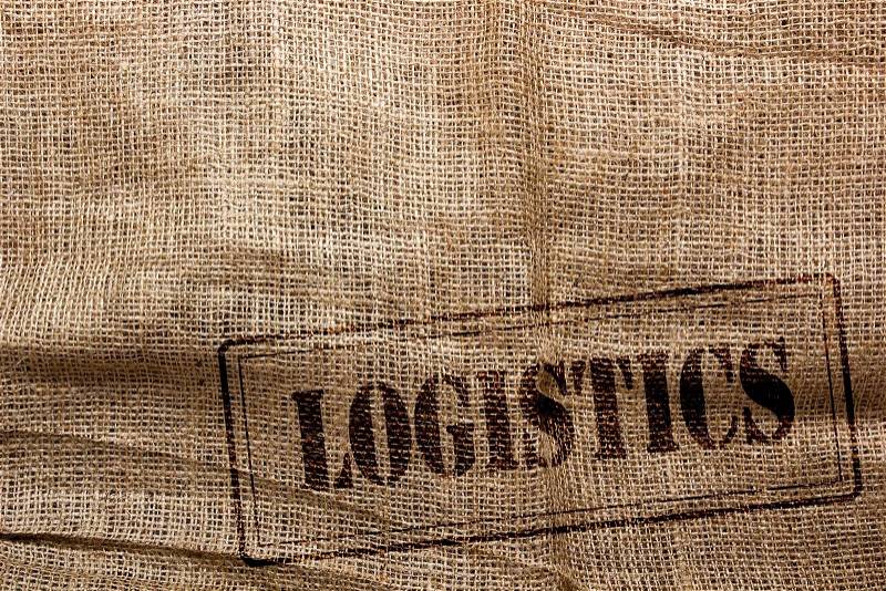 Background of burlap for packaging and further logistics, with a mark in the form of printing, stock photo