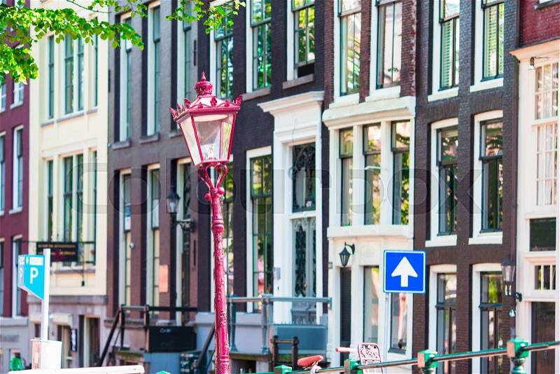 Traditional dutch buildings and blocks of flats in in old Amsterdam, Netherlands, stock photo