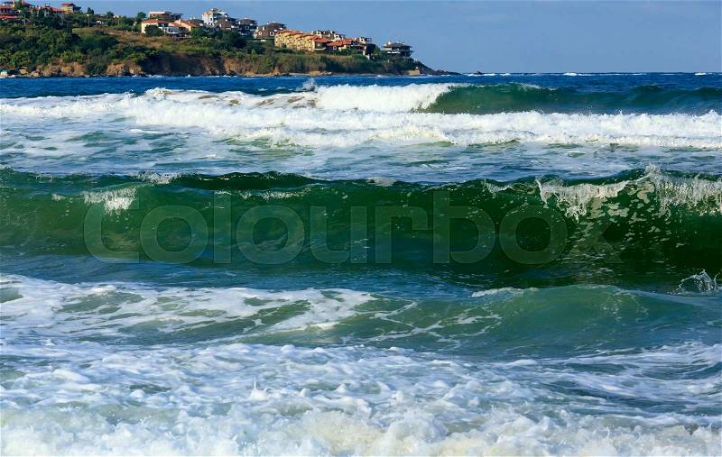 Sea stormy view from beach and houses on coast , Bulgaria, stock photo