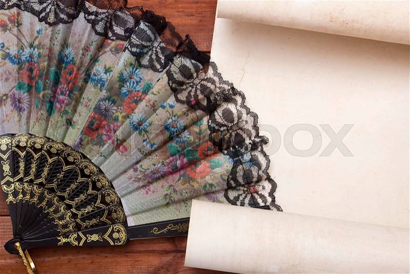 Parchment for your text with a female fan with a floral pattern, stock photo