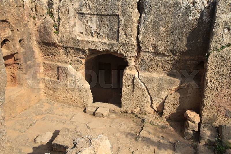 Entrance to the stone tombs of the kings in Paphos, close-up. Cyprus , stock photo