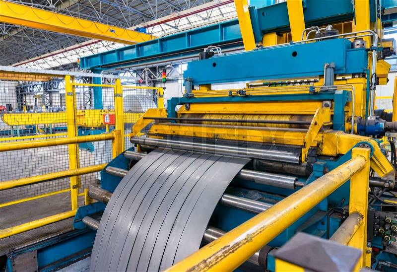 Cold rolled steel coil on decoiler of machine in metalwork manufacturing, stock photo