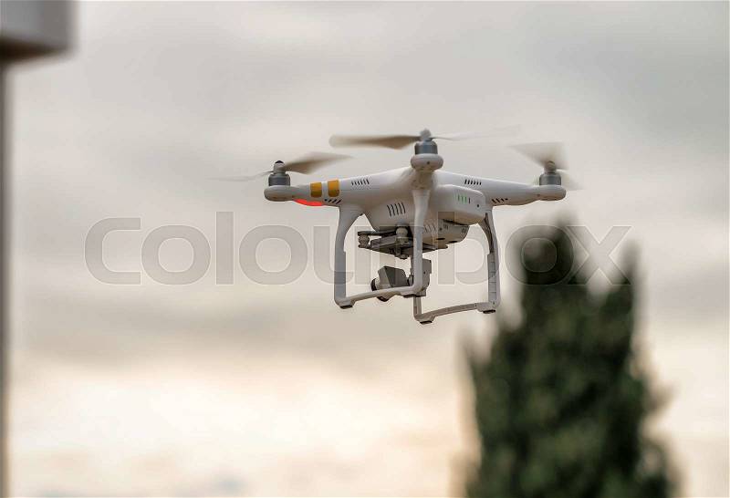 Industrial drone surveying construction site, stock photo