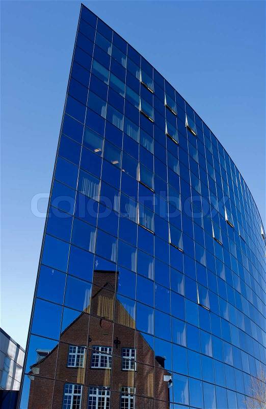 Futuristic public hospital building with reflection of old hospital building, stock photo