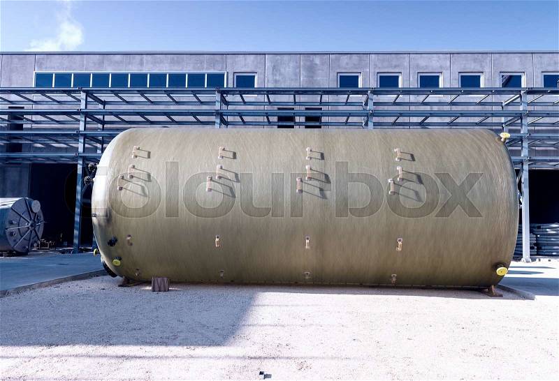 Chemical containers on construction site, stock photo