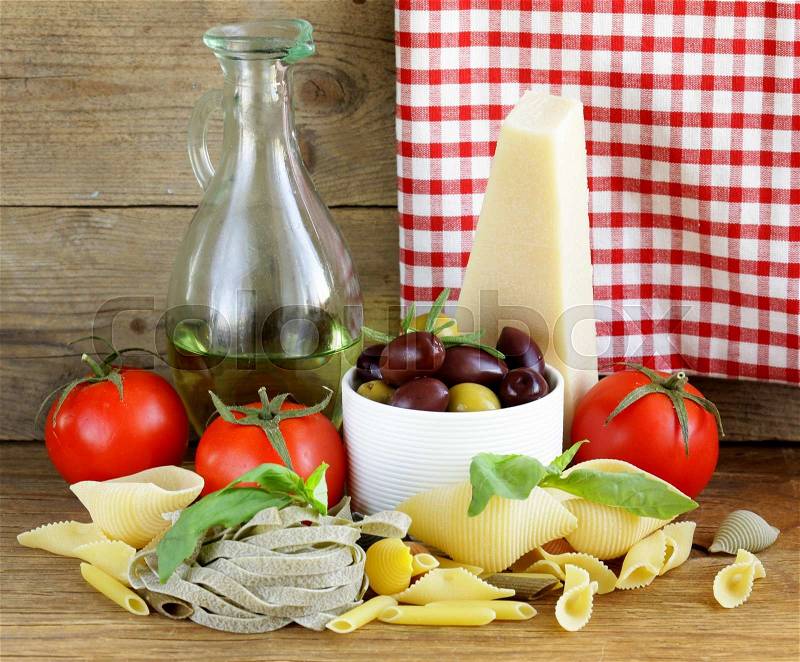 Still life of Italian foods (olive, oil, pasta, cheese), stock photo