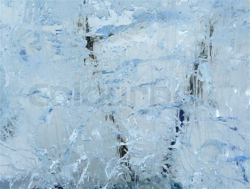 Glacial transparent block of ice with interesting drawings and patterns, stock photo