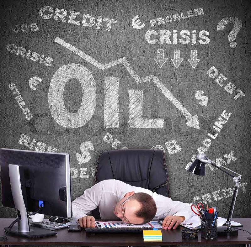 Tired businessman sitting in office. Concept of falling oil prices on the world market drawing on wall, stock photo