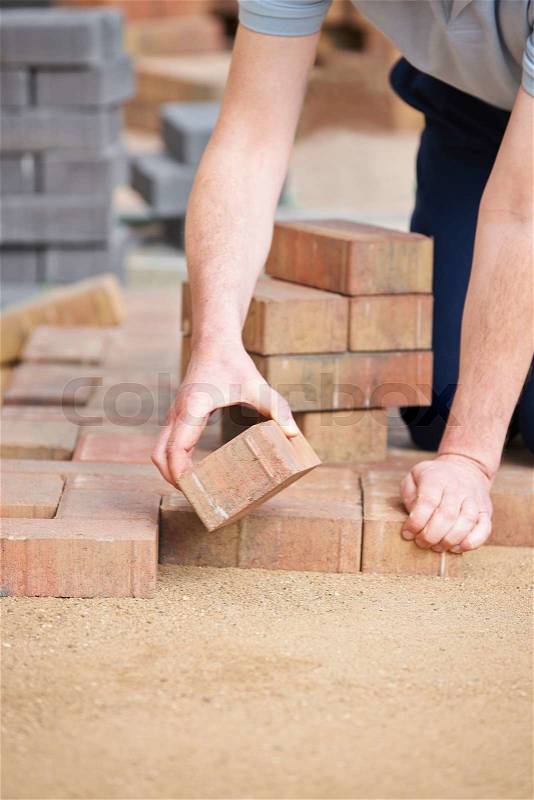 Man Laying Blocks For Patio, stock photo