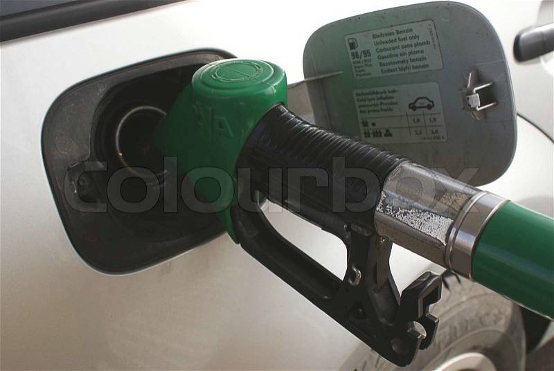 Filling the cars tank with gasoline, stock photo