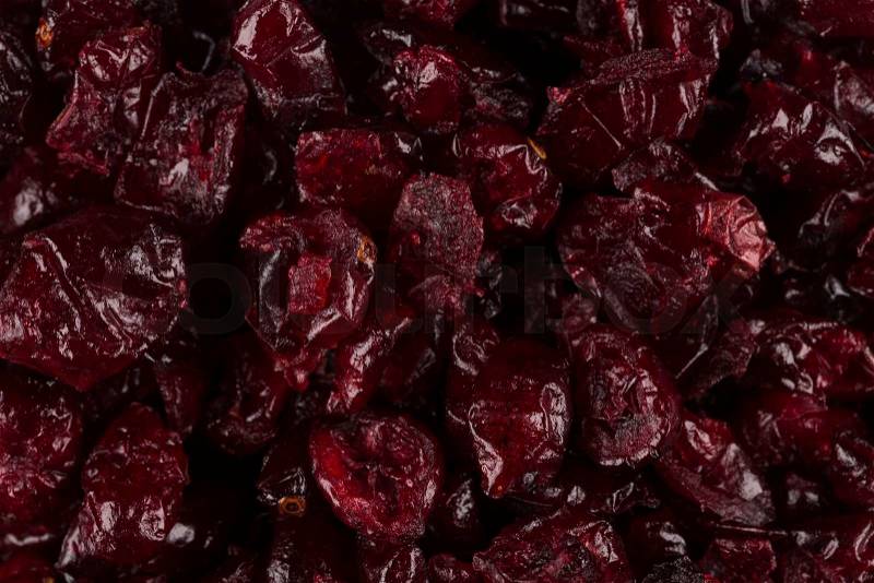Pieces of dried cranberries close up for background, stock photo