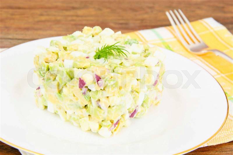 Salad with Avocado, Boiled Eggs, Red Onion and Mayonnaise Studio Photo, stock photo