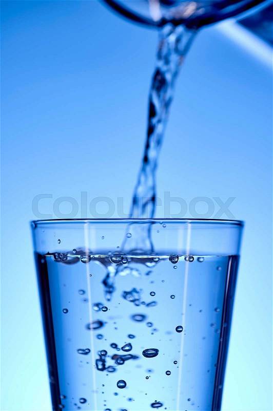 A studio photo of a tall water glass, stock photo