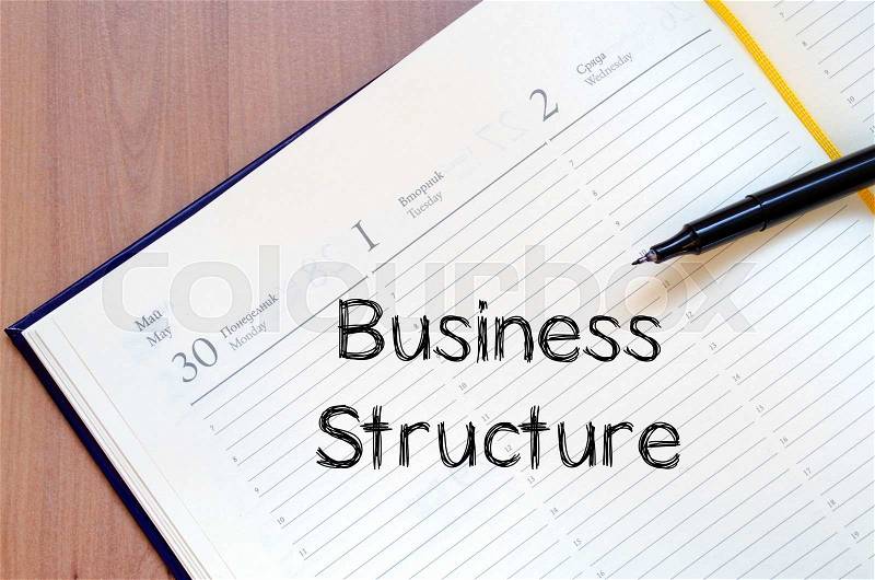Business structure text concept write on notebook with pen, stock photo