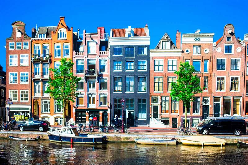 Traditional dutch medieval houses in Amsterdam, Netherlands, stock photo