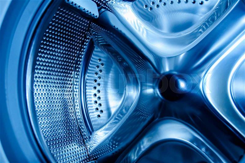 Clean blue light inside the washing machine - extreme detail useful file for repairing services, self-service laundry, stock photo