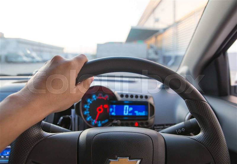 Driving and holding the steering wheel, stock photo