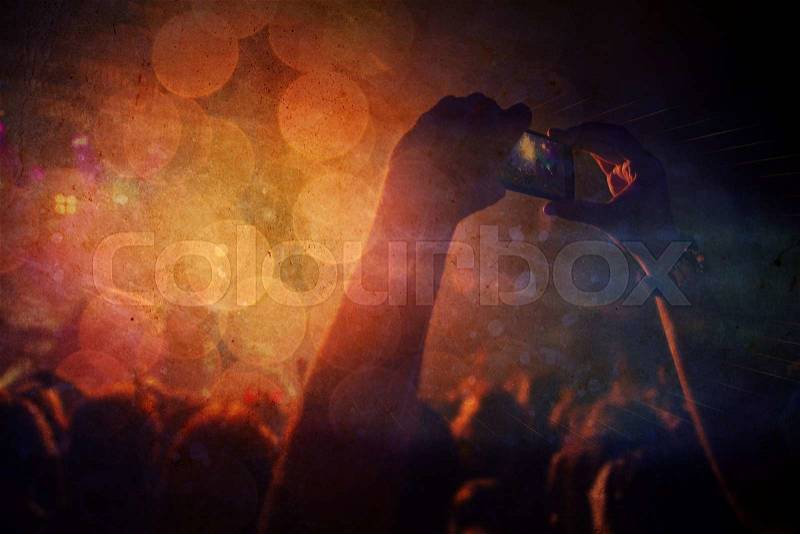 Silhouettes of people and musicians in big concert stage on grunge background, stock photo
