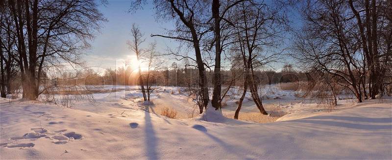 Winter sunrise in Belarus. Cold winter morning. Winter river, stock photo