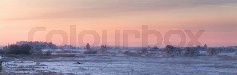 Cold winter dawn. Snowy morning panorama, stock photo