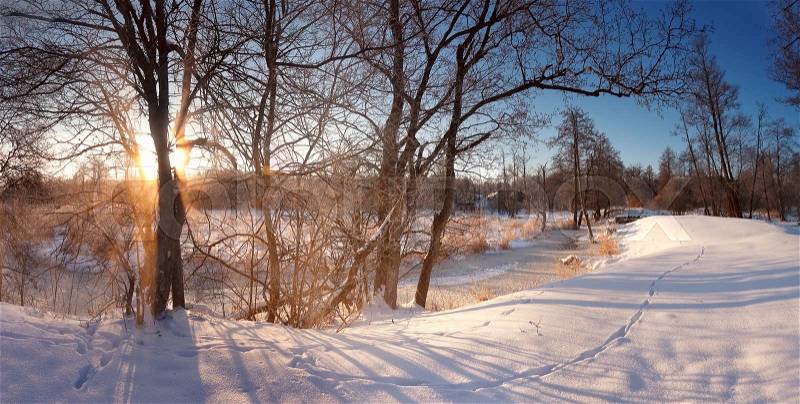Winter sunrise in Belarus. Cold winter morning. Winter river, stock photo