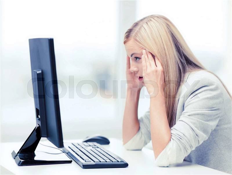Business, office, school and education concept - stressed businesswoman with computer at work, stock photo