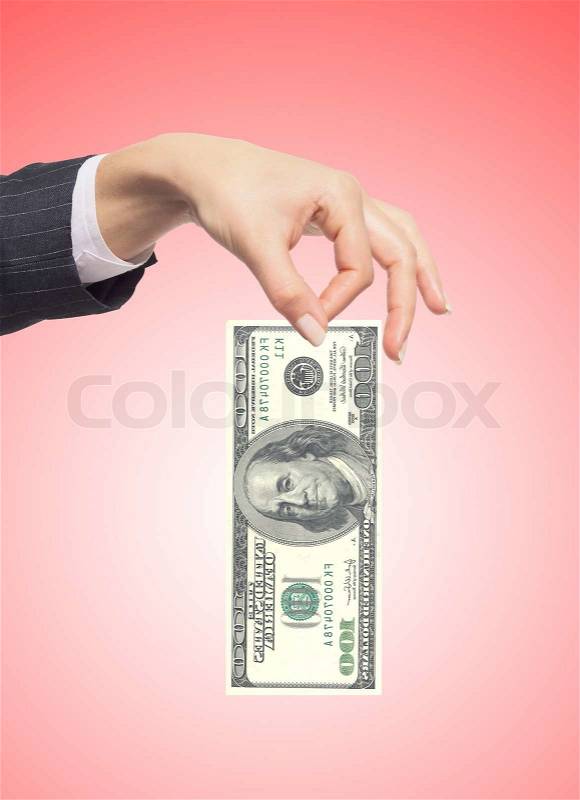 Hand holding money dollars over red background, stock photo