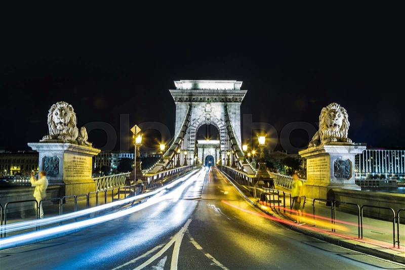 City of Budapest in Hungary night urban scenery, street on the Szechenyi Chain Bridge, stock photo
