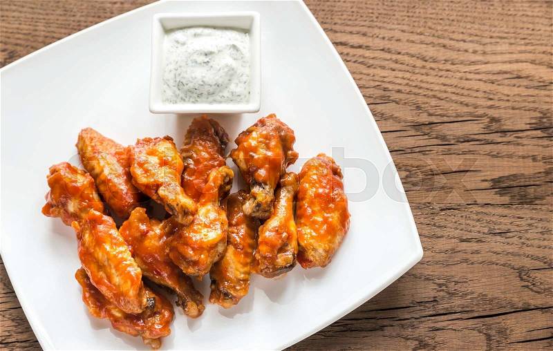 Portion of buffalo chicken wings, stock photo