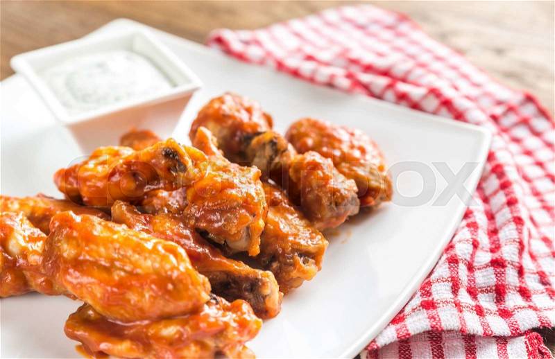 Portion of buffalo chicken wings, stock photo