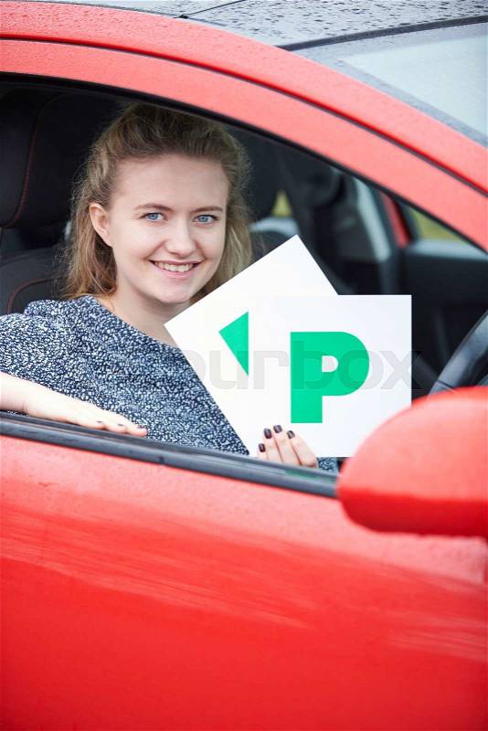 Teenage Girl Recently Passed Driving Test Holding P Plates, stock photo