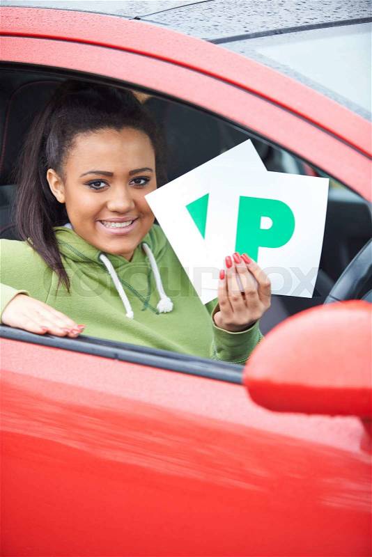 Teenage Girl Recently Passed Driving Test Holding P Plates, stock photo