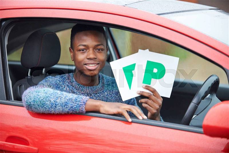 Teenage Boy Recently Passed Driving Test Holding P Plates, stock photo