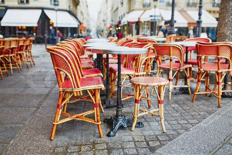 Cozy outdoor cafe in Paris, France, stock photo