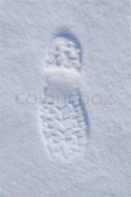 Human boot footprint in newly fallen snow, stock photo