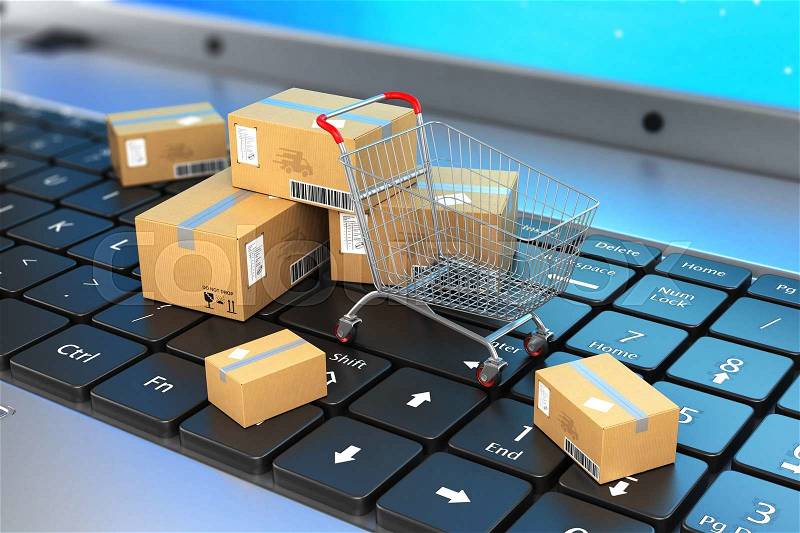 Shipping, delivery and logistics technology business industrial concept. Macro view of heap of stacked corrugated cardboard package boxes with trolley on laptop keyboard with selective focus, stock photo