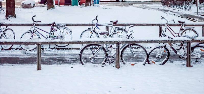 Bikes parking under the snow in Munich, stock photo