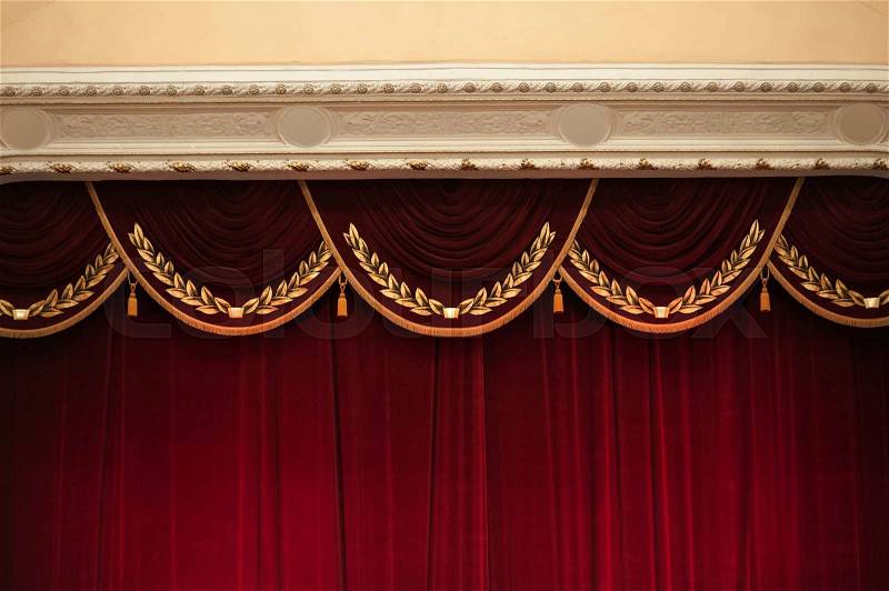 Beautiful decorated red curtains in theater top part, stock photo