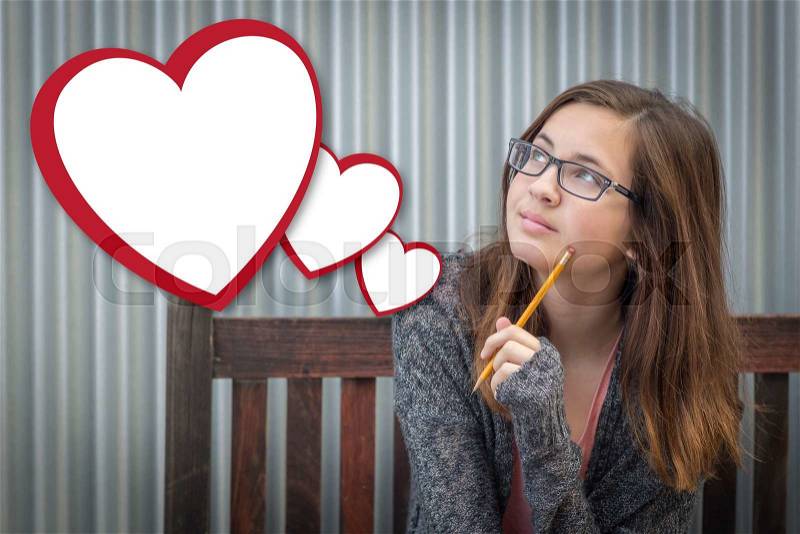Cute Daydreaming Girl With Blank Floating Hearts Clipping Path Included, stock photo