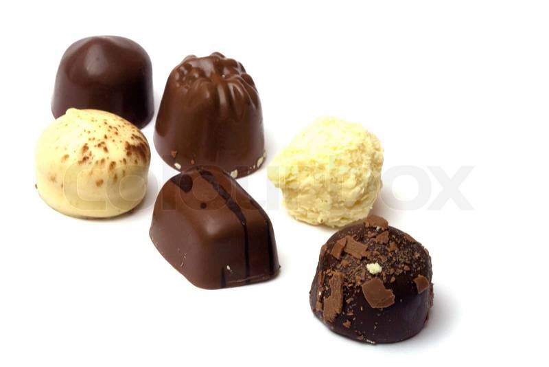 Chocolate truffle in white background - focus on first, stock photo