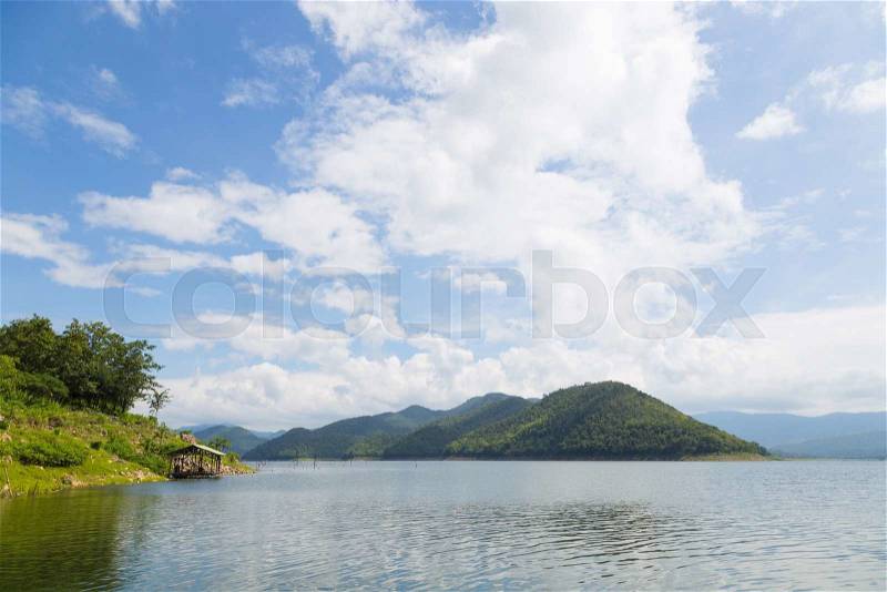 Mountains and water in the dam forest covered mountains and trees complete, stock photo