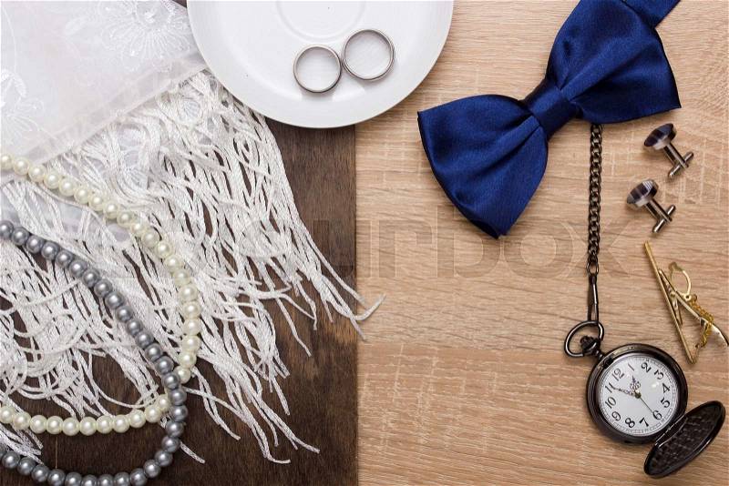 Male and female wedding accessories with wedding rings, stock photo